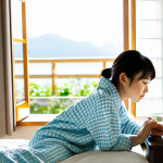 **Image Prompt:** "A young Japanese woman doing a gentle neck stretch in a bright, sunlit bedroom in the morning. She's wearing comfortable, modern pajamas. Focus on the peaceful atmosphere and the feeling of starting the day refreshed. Include elements like a glass of water on the bedside table and soft morning light. safe for work, appropriate content, fully clothed, modest, professional photography, perfect anatomy, natural proportions"